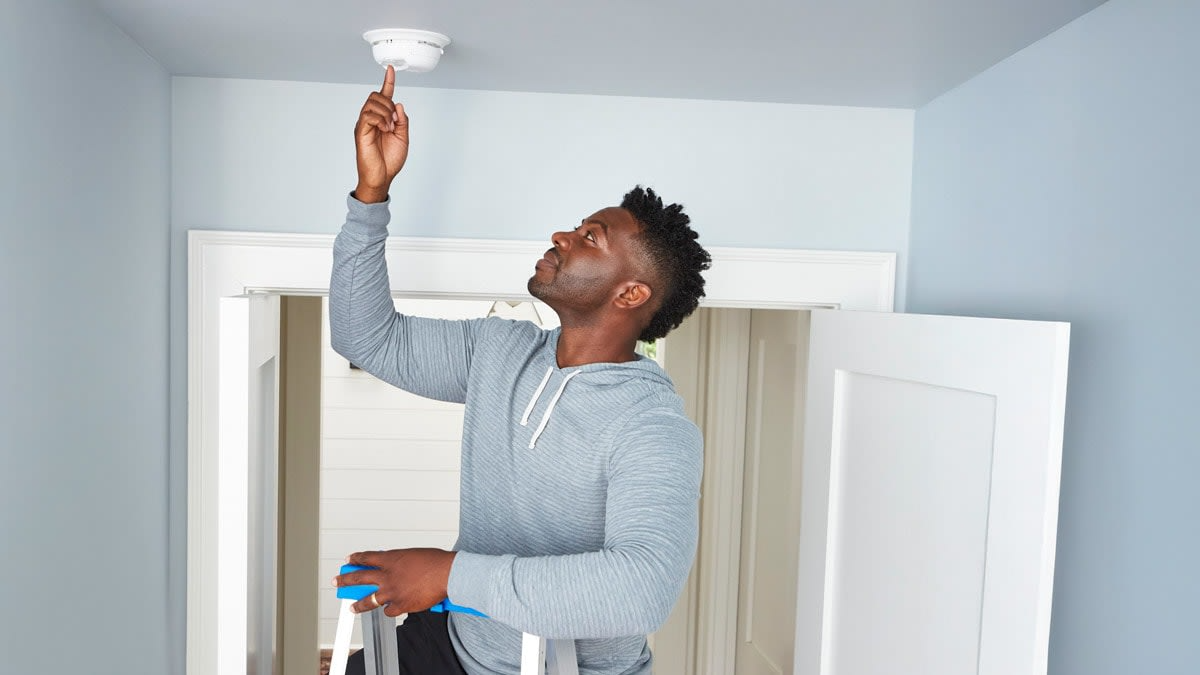 A grab bar being installed in a bathroom
